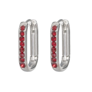 Detail view of silver U-shaped earrings featuring a row of sparkling red gemstones