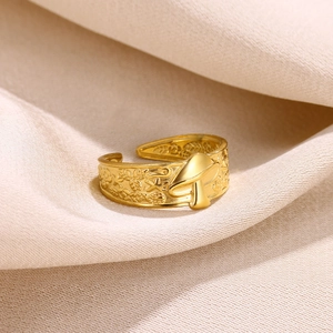 Macro shot of 18k gold plated ring featuring detailed mushroom and leaf engravings