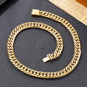 Men's hip hop gold Cuban link bracelet with square clasp on a textured dark background