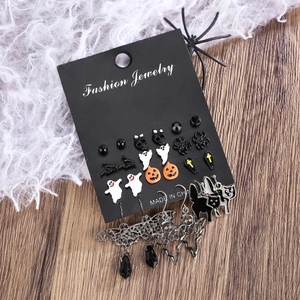 Gothic Halloween earring set featuring ghost, pumpkin, and spider designs on wood