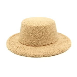 Detailed texture of khaki faux shearling flat top jazz hat with plush finish