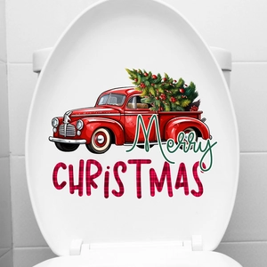 Close-up of a festive red truck and Christmas tree waterproof decal on a white toilet lid