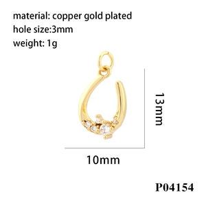 Detailed view of 18K gold plated U-shaped charm with cubic zirconia for jewelry making