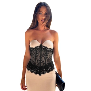 Detail of the sheer black lace corset waist on the beige satin bodycon evening dress