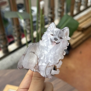 Detail view of Samoyed dog hair claw clip with white pearlescent acetate texture