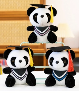 Detailed view of three graduation panda plush toys with caps and colorful tassels
