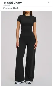 Women's black yoga set with slim fit short sleeve top and high waist wide leg pants