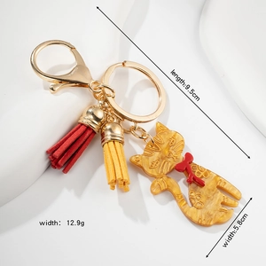 Cute cat keychain with colorful tassels and detailed amber cat pendant, 9.5cm length