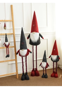 Detail of Christmas gnomes with telescopic legs and snowflake knitted hats for decor