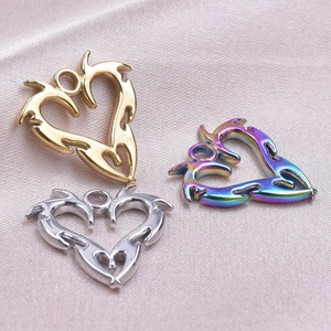Polished stainless steel flame heart pendants in gold, silver, and rainbow colors