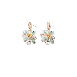 Luxury floral crystal earrings with green iridescent petals and golden metal finish