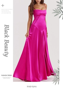 Detail of elegant fuchsia satin maxi dress showing slim fit cut and silk texture