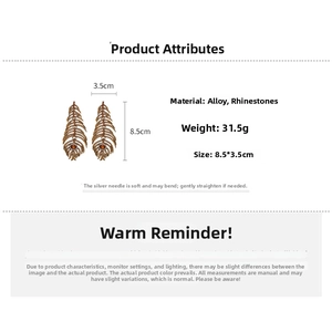 Detail of luxury rhinestone feather earrings in vintage gold finish with silver needle