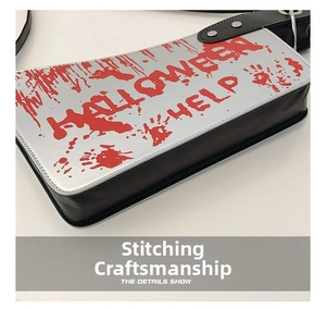 Close-up of the stitching detail on a blood-stained Halloween cleaver bag