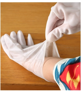 Detail of white semi-transparent waterproof household gloves with anti-slip texture