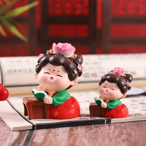 Classic Tang Dynasty style lady figurines in green robes reading books for home decor