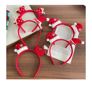 Close-up of plush Christmas headbands with festive hat and star decorations