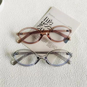 Fashionable round oval eyeglasses frames in amber and transparent grey for women