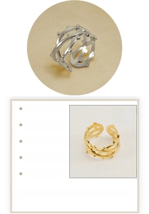 Detail of 18K gold plated stainless steel rings featuring a woven cross design and beads