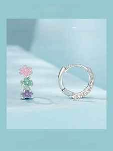 Close-up of 925 sterling silver flower hoop earrings with colorful enamel petals