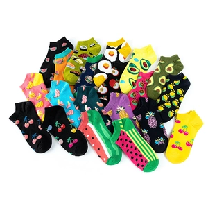 Colorful patterned low cut ankle socks with vibrant fruit and food prints on white background