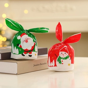 Christmas gift bags with long bunny ears featuring Santa Claus and snowman patterns