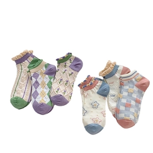 Pastel ruffled ankle socks set featuring floral and checkerboard patterns in macaron colors