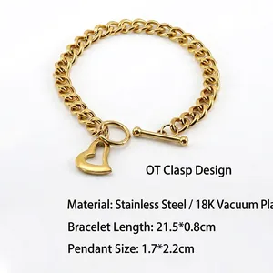 Detailed shot of 18K gold plated stainless steel Cuban bracelet with heart pendant and OT clasp