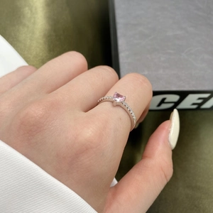 Detailed close-up of a S925 silver ring featuring a pink heart-shaped gemstone and zircons
