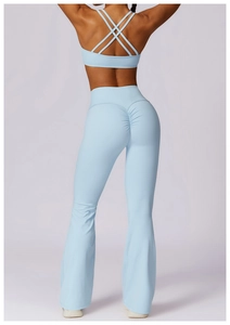 Close-up of light blue yoga set featuring a scrunch butt design and high-waisted flared pants