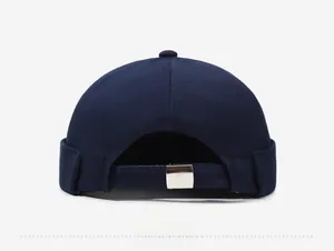 Detail view of the navy cotton docker hat back showing the adjustable metal buckle strap