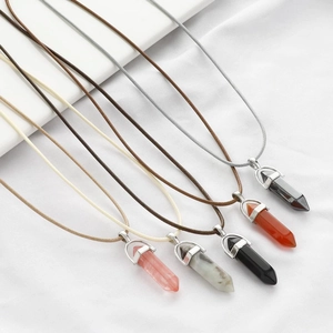 Detail of five hexagonal crystal stone pendants with braided wax rope necklace strings