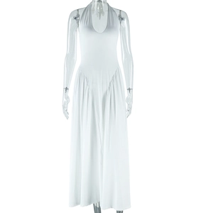 Detail of white halter neck backless long dress with high waist flowy skirt