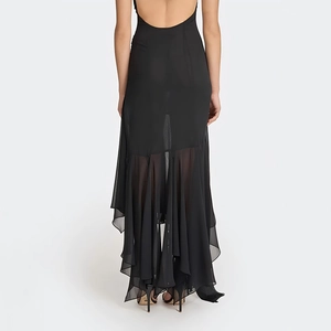Detail of sheer chiffon irregular hem and backless design on this sexy black maxi dress