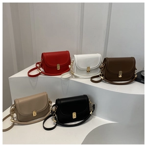 Selection of five stylish saddle bags in red, white, brown, beige, and black colors