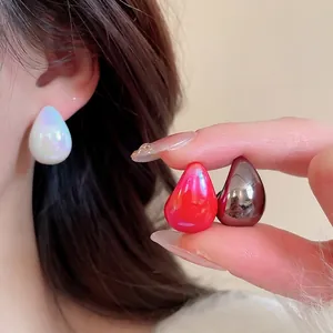 Iridescent acrylic teardrop stud earrings set in white red and charcoal grey minimalist style