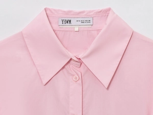 Detail of pink cotton poplin shirt collar featuring button and YHWM brand woven label
