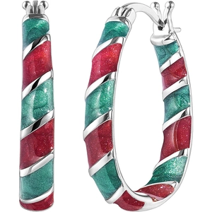 Close-up of red and green spiral striped hoop earrings with shimmering festive finish