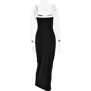 Detail of slim fit black maxi dress with white spaghetti straps and contrast neckline
