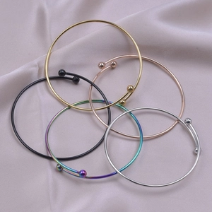 Five-piece set of adjustable stainless steel open bangles with ball ends in assorted colors