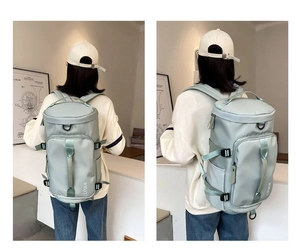Rear and side view of mint green water-resistant nylon travel backpack on model