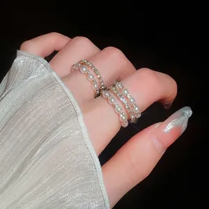 Gold multilayer open ring set with elegant pearls and sparkling zircons for women