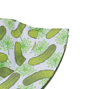 Detailed macro view of white bucket hat featuring green cucumber print and double stitching