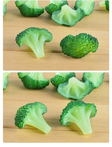 Detailed close-up of realistic PVC broccoli food model with intricate bud texture