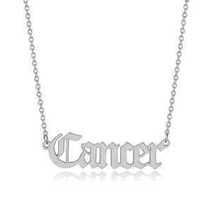 Detailed shot of silver titanium steel Cancer zodiac pendant on a thin link necklace