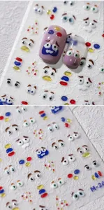 Macro detail of 3D gel nail art stickers with cartoon eye expressions and jelly texture