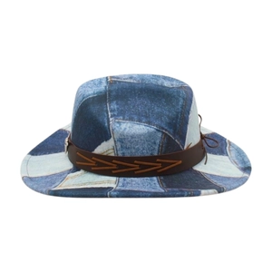 Vintage patchwork denim cowboy hat with brown leather band and wide brim for travel