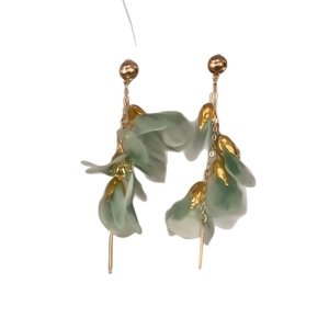 Elegant gold drop earrings with delicate light green mesh flower petals and long tassels