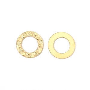 Detail of gold stainless steel pendants with floral texture and smooth mirror finish