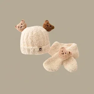 Detail of baby winter hat and scarf set with cute bear ears in cream fleece fabric